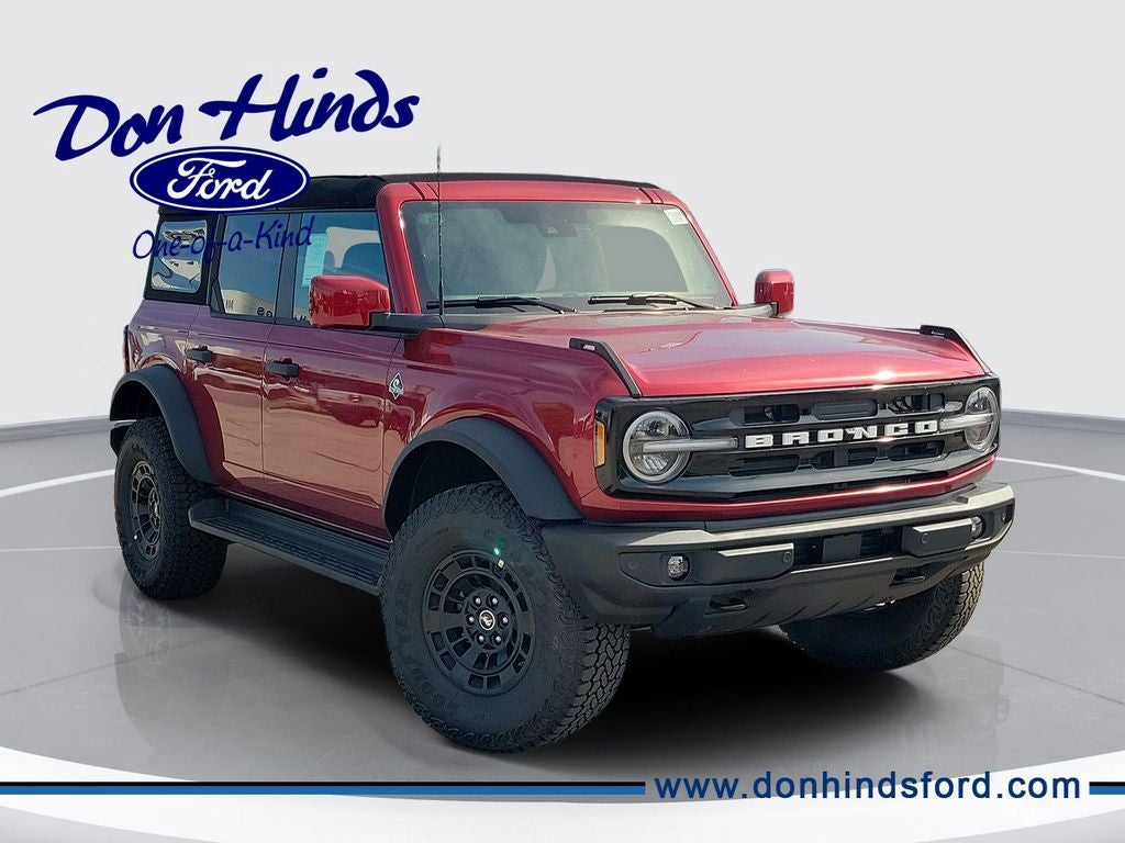 2026 Ford Bronco Outer Banks in Ruby Red Metallic — front three-quarter view