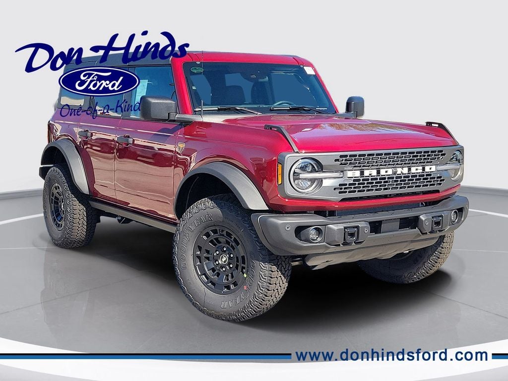 2026 Ford Bronco Badlands in Ruby Red Metallic — front three-quarter view