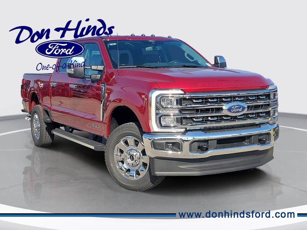 2026 Ford F-350SD Lariat in Ruby Red Metallic Tinted Clearcoat — front three-quarter view
